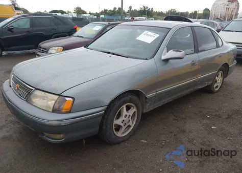1999 Toyota Avalon Xls z USA, uszkodzony, nr VIN 4T1BF18B9XU299912